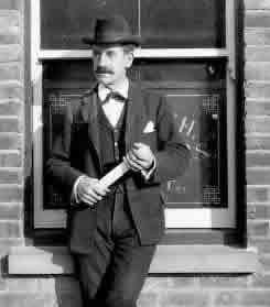 E A Stickland Esq, posing outside his office window at the Borough offices, Alma Road in around 1910.
